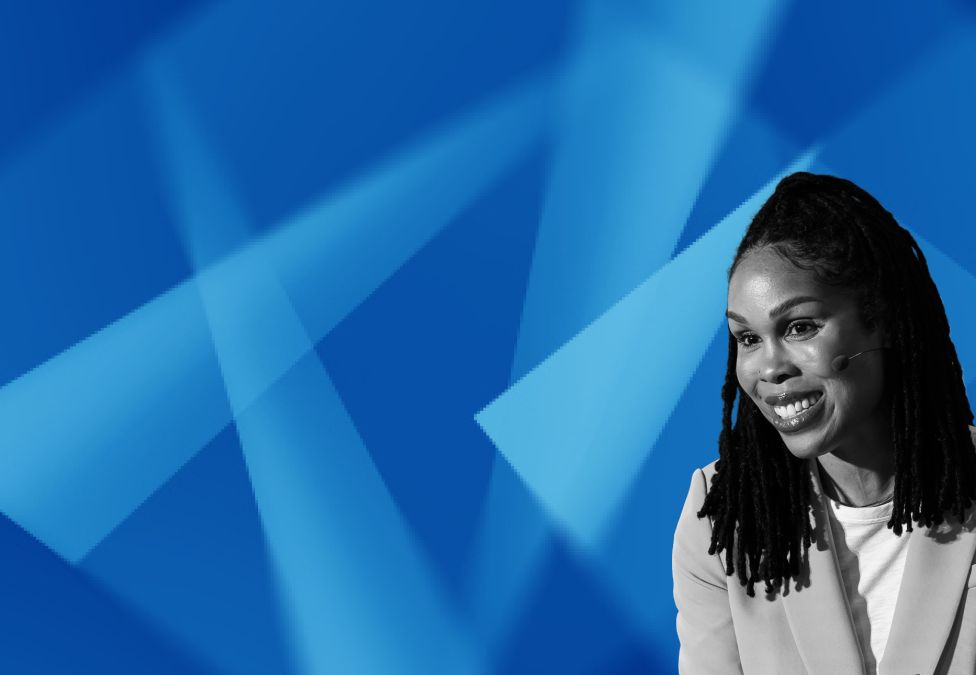 Woman with long dark hair against blue geometric background
